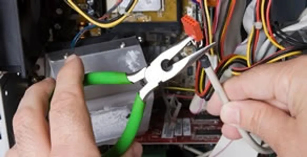 Licensed electrical contractor performing electrical repair with tools in Spring Valley, CA