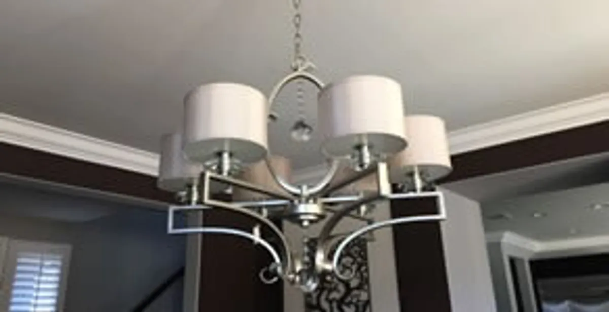Modern chandelier installation with multiple light fixtures in San Diego, CA